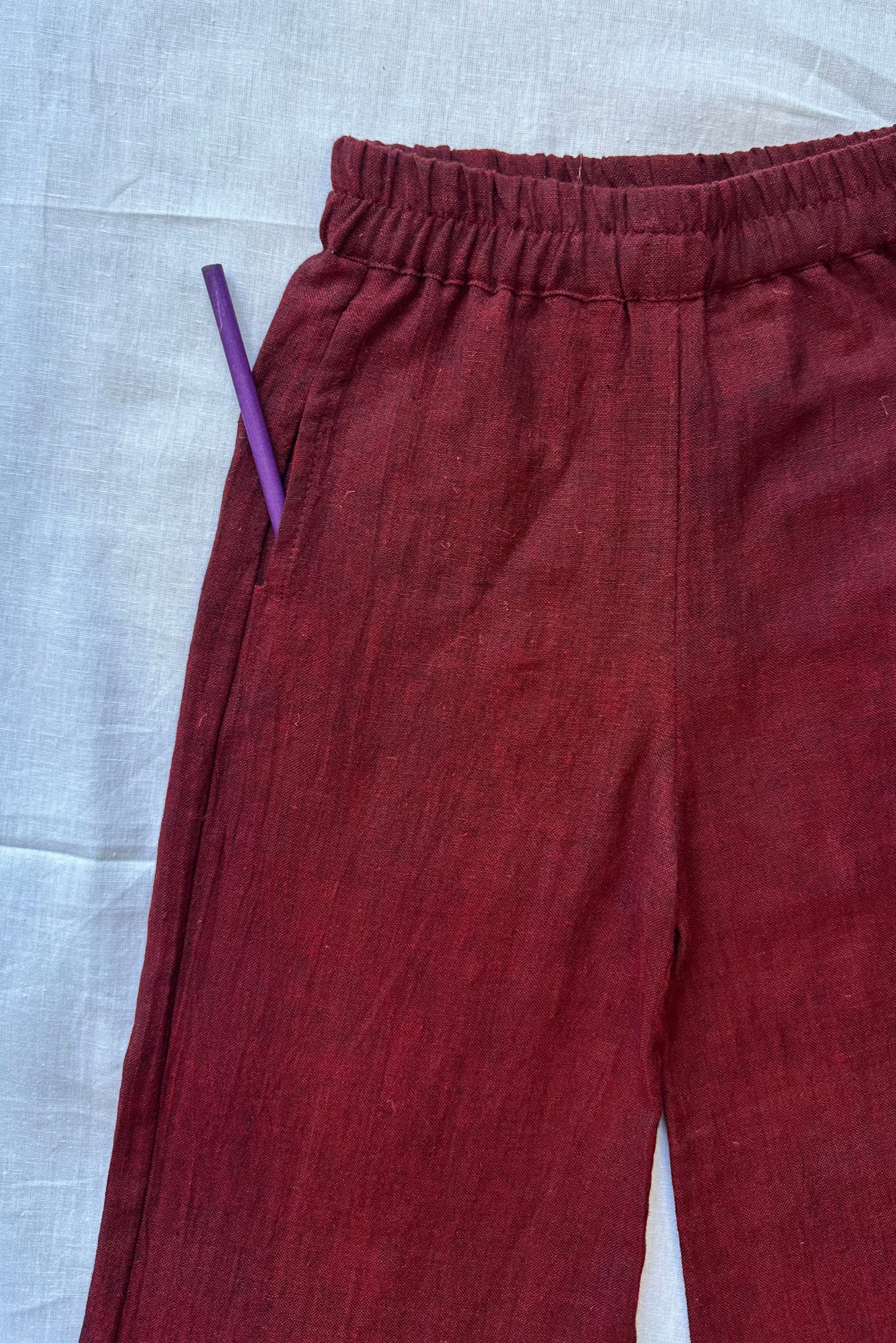 Blue top and maroon pants