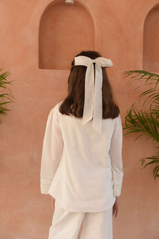 casual kids white top close‑up