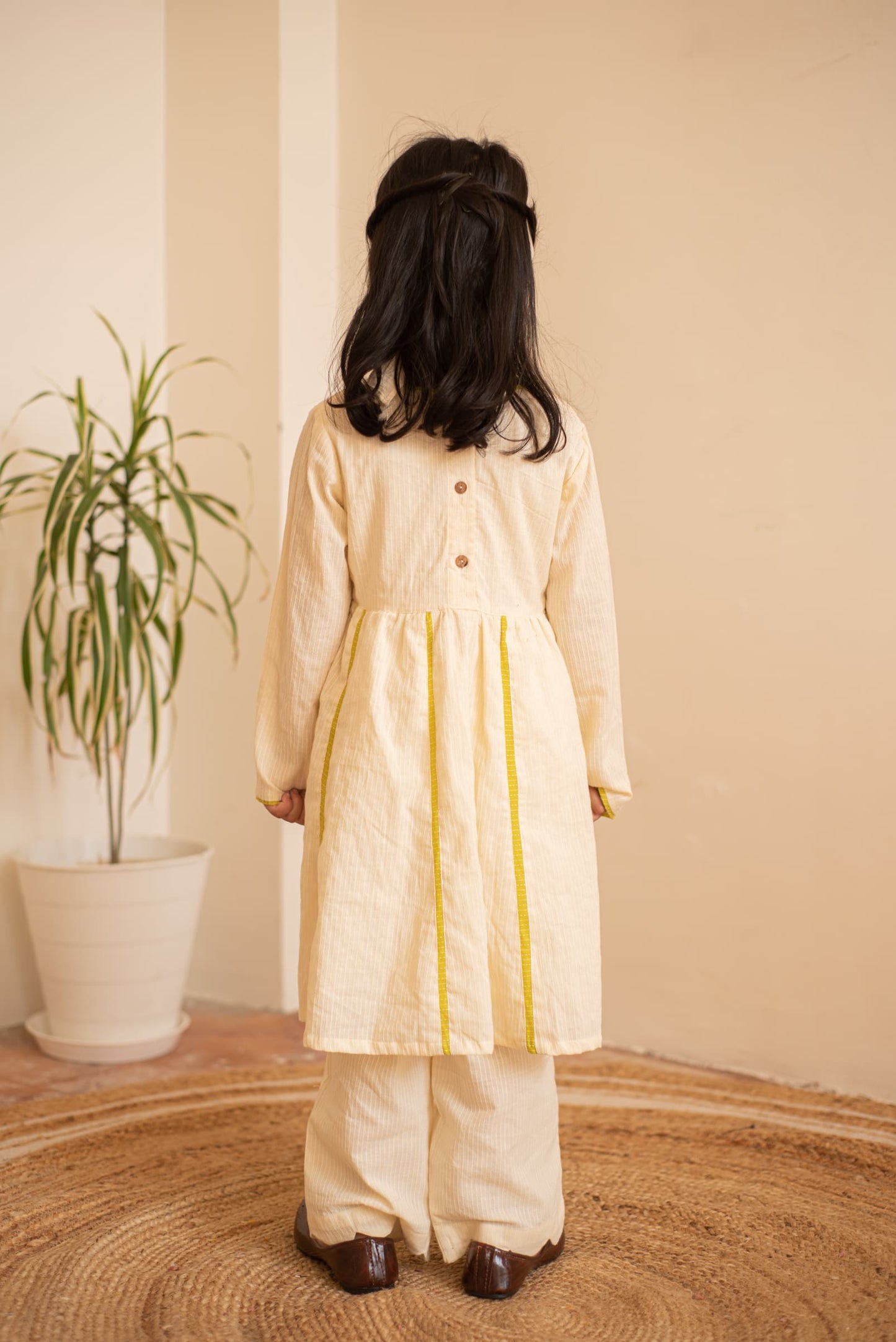 festive kids green kurta outfit close‑up